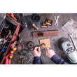 An overhead view of an industrial MRO professional applying GorillaPro EP3 epoxy adhesive to a work piece. (Product image)