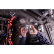 An overhead view of an MRO professional applying GorillaPro AS10 white pipe and thread sealant to a threaded pipe. (Product image)