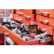 A photo of a bottle of GorillaPro AT150 red high strength threadlocker in a tool chest next to hand tools. (Product image)