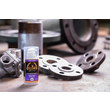 A photo of GorillaPro AG101 liquid gasket maker next to metal tubes and flanges where it would be used. (Product image)