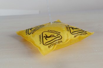 Picture of Meltblown Technologies Osmo Mega Thirsty Pad Yellow w/Black Caution Sign Polypropylene/Cellulose/SAP 80 gal Absorbent Pad (Main product image)